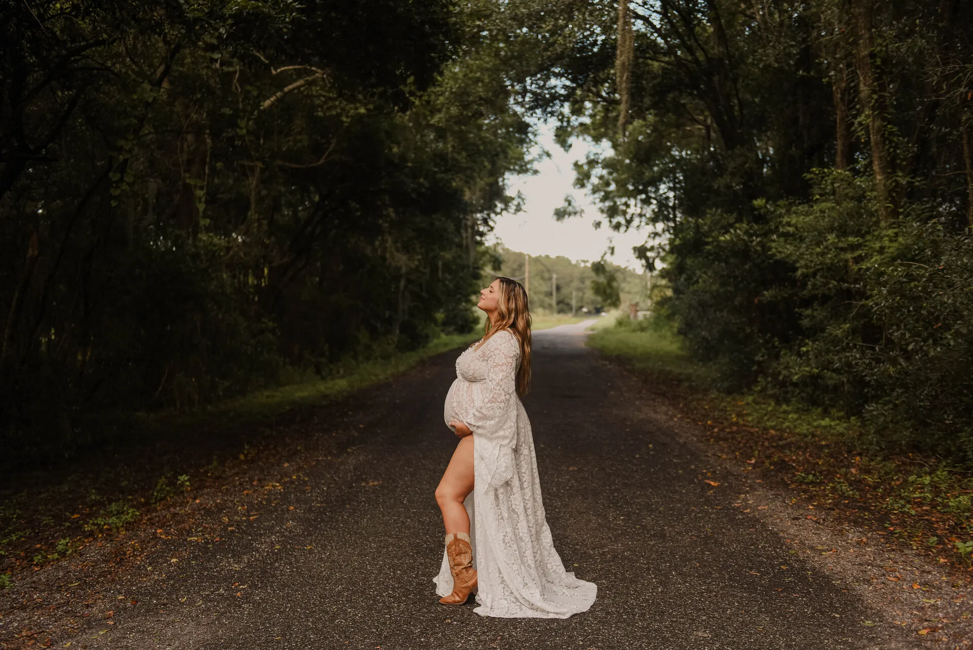 Pregnant woman standing in the road